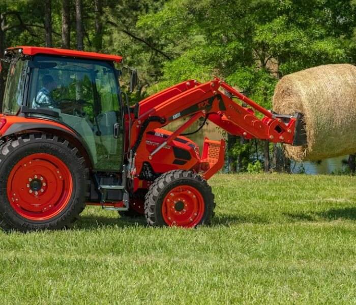 Efficient Lawn Mowing by Expert with Gas Mower Adult man engaging in lawn care with a powerful gas-powered mower.