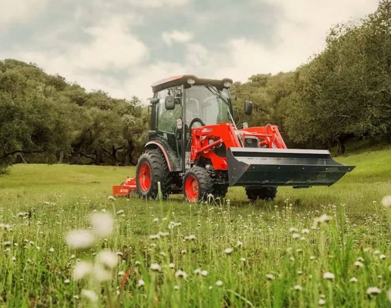 Maintaining Lawn Perfection with Gas Mower Gentleman mowing large garden area with a high-capacity gas mower.